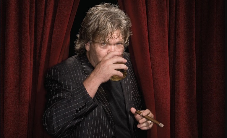 Ron White drinks Macallan Scotch whisky and smokes Cuban Davidoff cigars during the performance